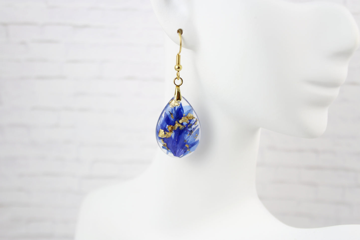 Teardrop earrings with blue Cornflower on gold plated hooks